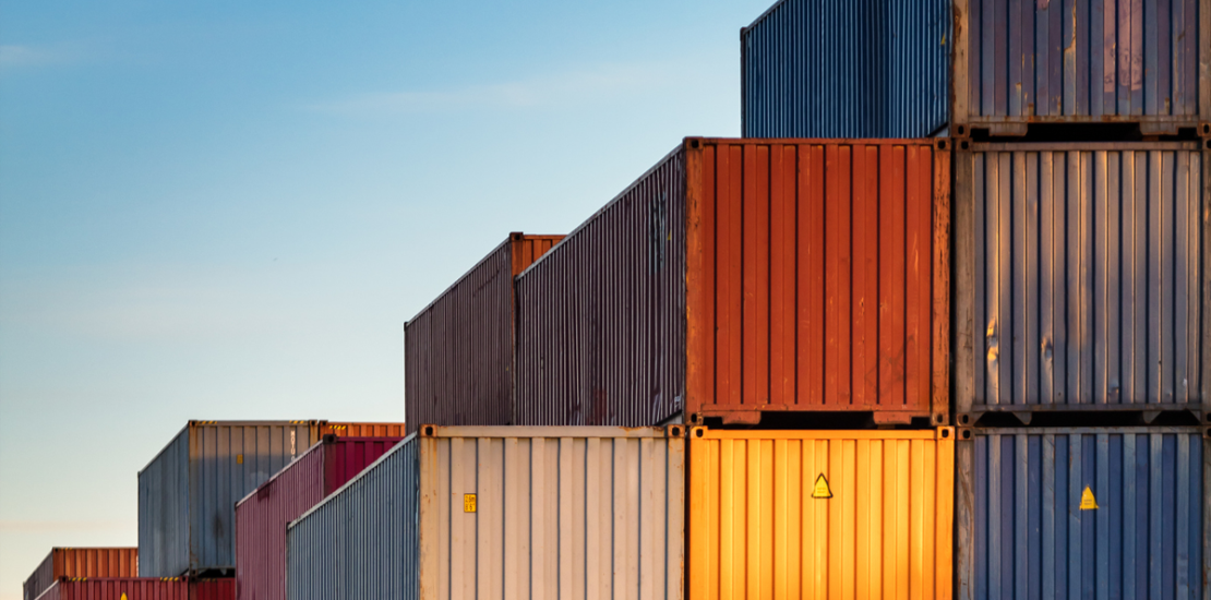 Stacked shipping containers illustrating supply route concentration risk in strategic foresight, Clarion Consulting