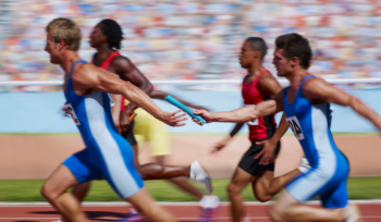 Relay baton handoff illustrating family business generational transition and succession readiness, Clarion Consulting