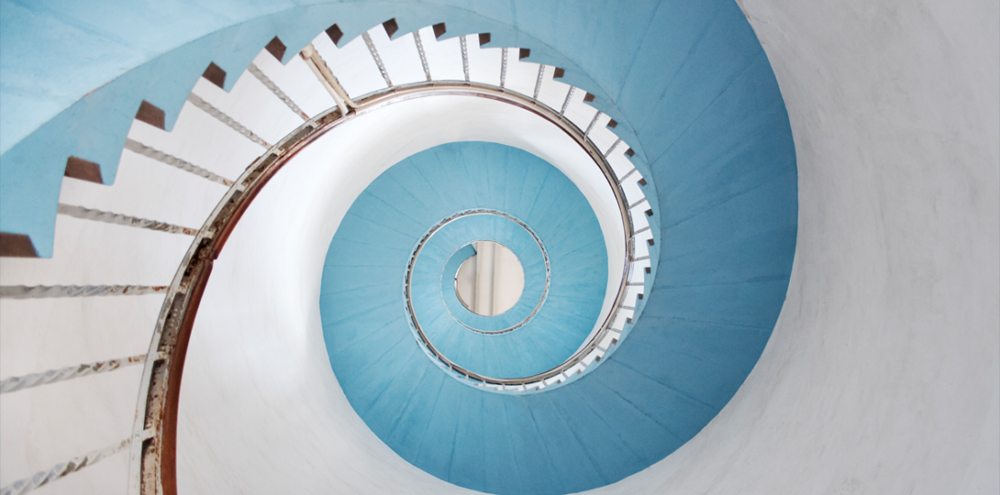 Spiral staircase illustrating upward strategic communication from the front line to leadership, Clarion Consulting