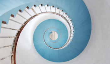 Spiral staircase illustrating upward strategic communication from the front line to leadership, Clarion Consulting