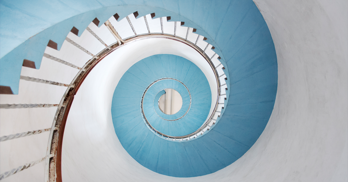 Spiral staircase illustrating upward strategic communication from the front line to leadership, Clarion Consulting